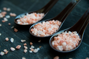 Studio shot of three spoons of pink himalayan salt