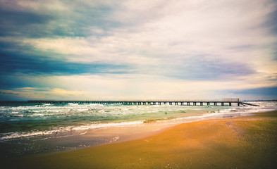 dramatic seascape with pier