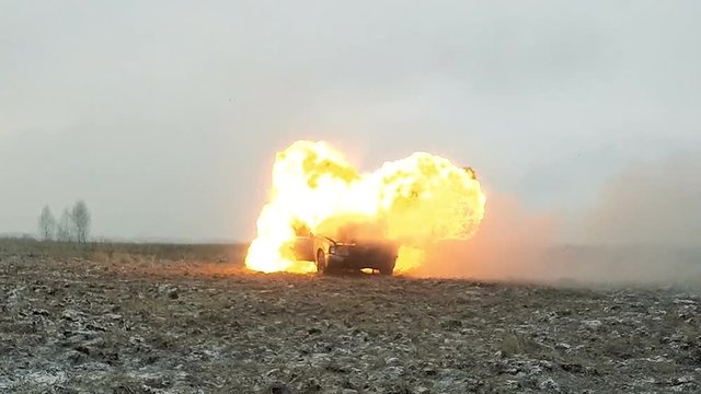 Car explosion in the field. Slow Motion X4