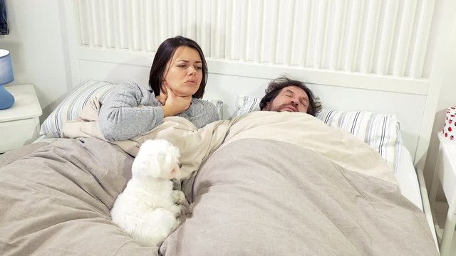 Couple in bed sick with strong allergy in spring