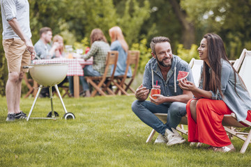 Smiling woman at friend's party