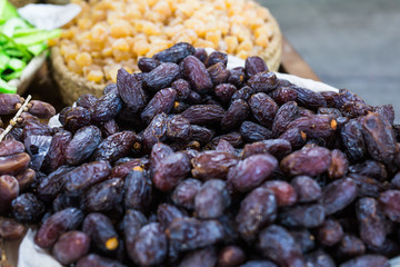 Fresh dates in a market - healthy lifestyle, food and fruit concept