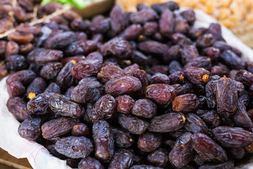 Fresh dates in a market - healthy lifestyle, food and fruit concept