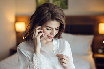 Young attractive woman talking on a phone