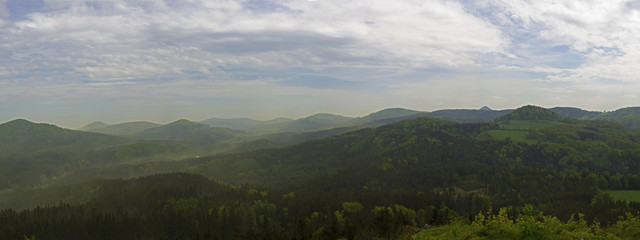 Fototapeta premium luzicke hory mountains wide panorama, skyline view from hill stredni vrch, green forest and blue sky, white clouds background