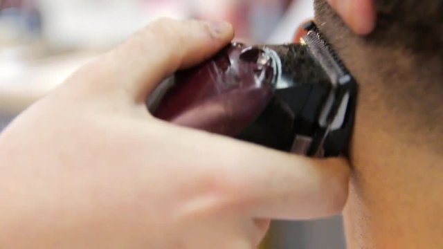 Barber Cuts the Hair in the Barbershop. Slow Motion