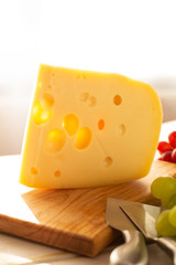 Dutch hard cheese Maasdam or Emmentaler, cheese with holes