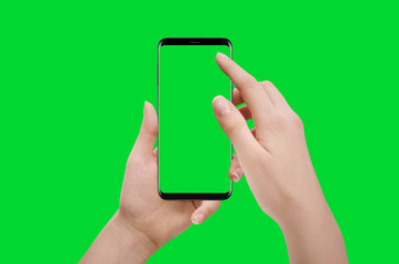 Female hands holding smartphone, isolated on green background