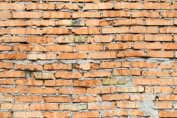 Red brick wall with smeared cement solution