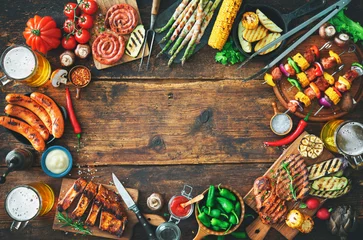 Türaufkleber Grilled meat and vegetables on rustic wooden table © Alexander Raths