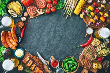 Fotobehang Grilled meat and vegetables on rustic stone plate © Alexander Raths