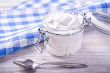 Sour cream in a glass jar