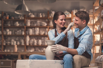 Young couple in pottery