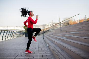 Fitness woman jumping outdoor