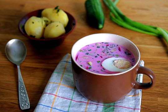 Cold Lithuanian soup with beets, greens and eggs. Served with boiled potatoes
