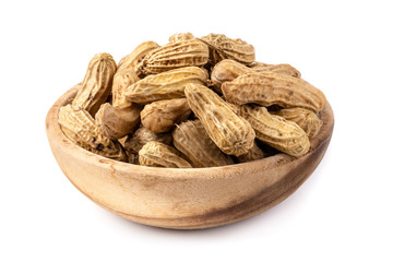 Dried peanuts in wooden bowl isolated on a white background