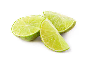 Juicy slice of lime isolated on a white background.
