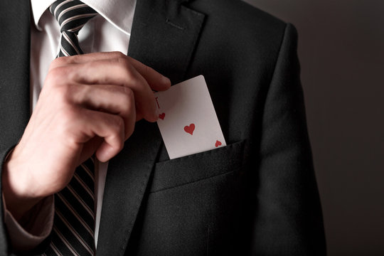 Business man with ace in the pocket of his jacket.