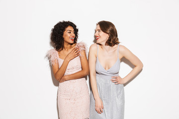 Portrait of two happy well dressed women laughing