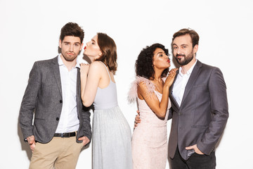 Group of happy well dressed multiracial people kissing