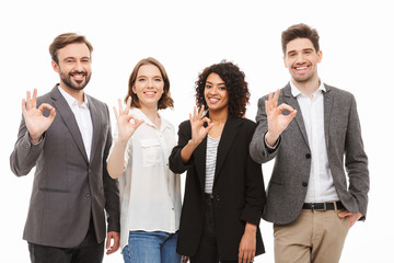 Group of happy multiracial business people showing ok