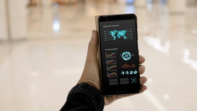 4K Hands of woman using using smartphone with HUD head up display user interface for mobile application technology concept
