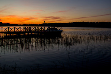 Sunset over lake and boat