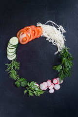 round frame with fresh vegetables