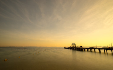 Fototapeta na wymiar scenic of sunrise and ocean dock in the sea