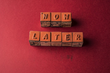 Procrastination with letters Now and later - obrazy, fototapety, plakaty