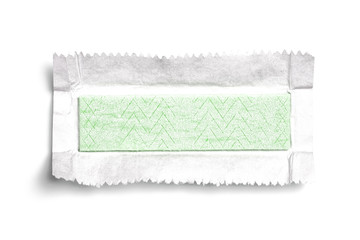 Top view of unwrapped chewing gum on white background