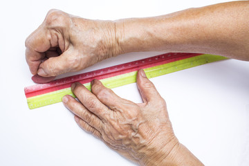 Senior woman's hands holding ruler with triangular chalk tailor isolated on white background, About tailor