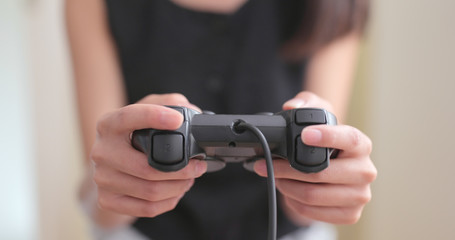 Close up of Woman playing game on console