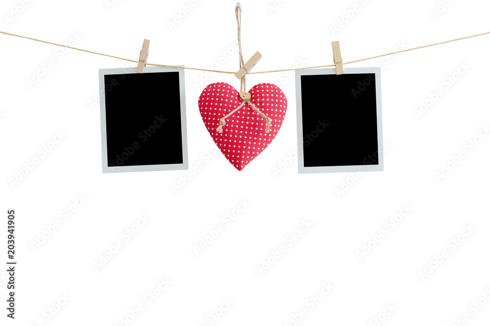 Wall mural Blank instant photos and red heart hanging on isolated white with clipping path.