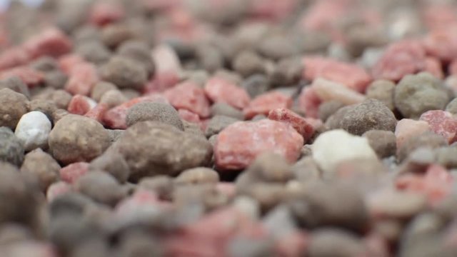Slow motion macro dolly shot of synthetic agricultural fertilizer.