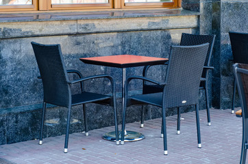 Table with chairs in the cafe summer terrace