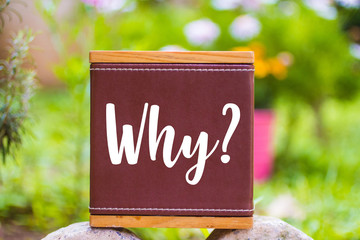 Why ? text on a leather box over tow rocks outdoor , Business Concept - obrazy, fototapety, plakaty