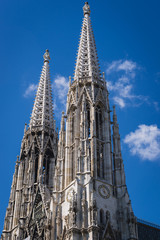 Side view of towers of famous Votive Church in Vienna city, capital of Austria