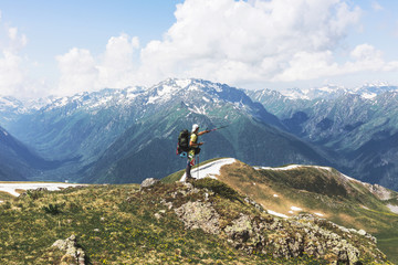 Man traveler backpacker with GPS navigator, pointing way trekking pole.