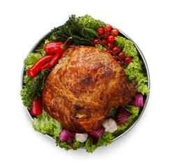 Baked chicken and vegetables platter isolated on white