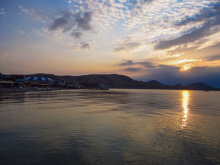 Fototapeta na wymiar Sunset. Solar path on the sea water. Cape Hamelion. Crimea