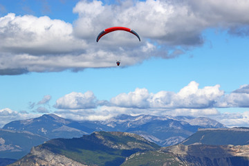 Paraglider flying in the French Alps
