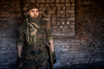 The Arab soldier with the AK-47 Kalashnikov assault rifle