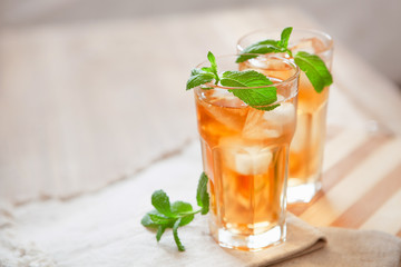 Refreshing summer drink with lemon, mint and ice copy space