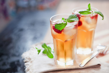 Refreshing summer drink with raspberry, mint and ice copy space