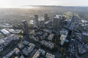 Cityscape aerial view of Century City with West Los Angeles and Santa Monica California in background.