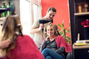 Professional hairdresser working at the salon