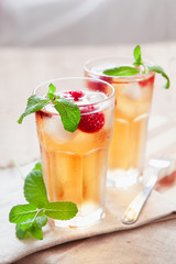 Refreshing summer drink with raspberry, mint and ice copy space