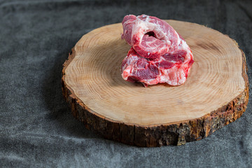 one pieces of pork isolated on dark background