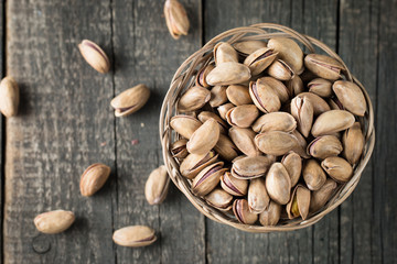 Healthy mix nuts on wooden background. Almonds, hazelnuts, cashews, peanuts, pistachios, brazilian nuts